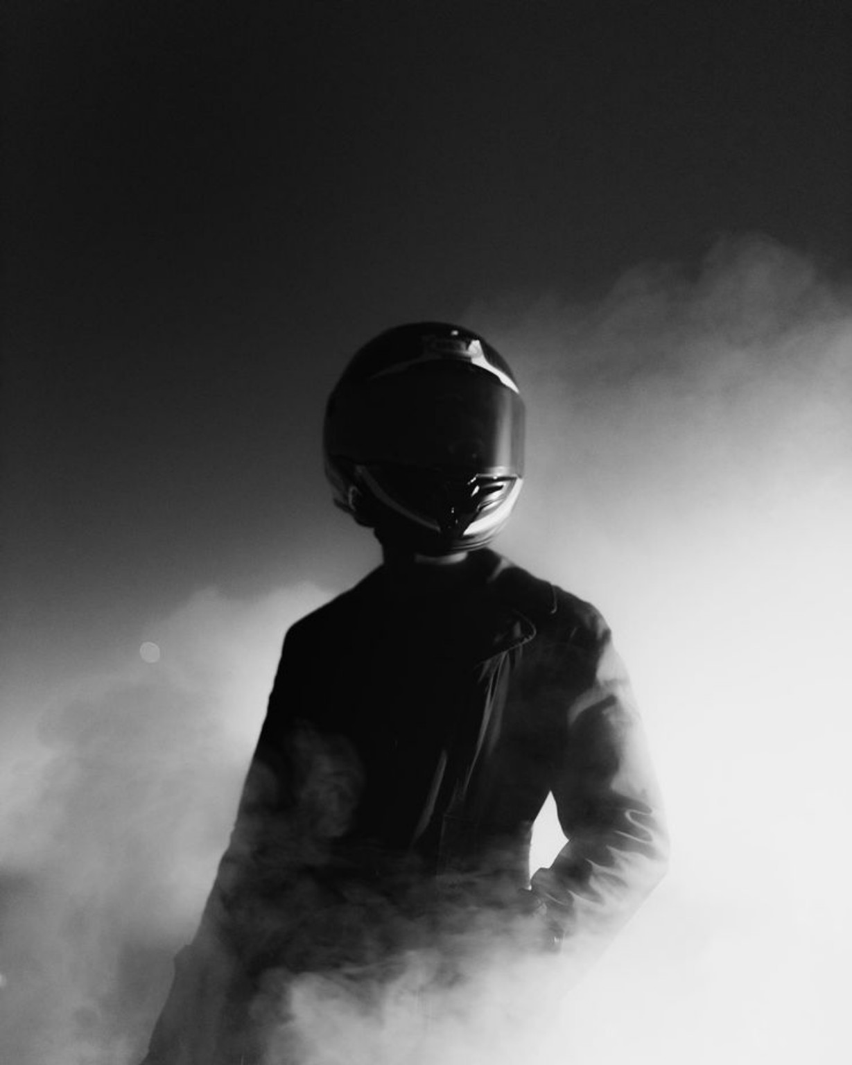 Motorcycle rider surrounded by smoke